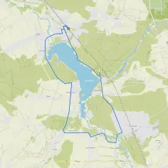 Mapa turystyczna z zaznaczoną trasą wokół Jeziora Porajskiego. Widoczne miejscowości: Poraj, Komornik, Kuźnica.